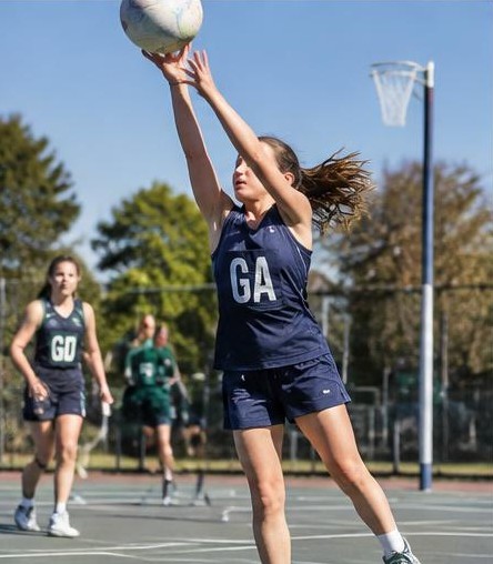 Junior netball player in action